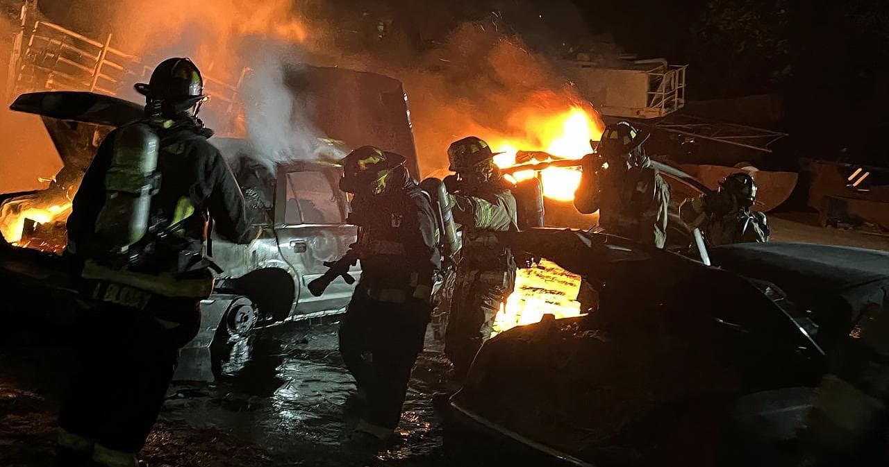 Firefighter I students at a live vehicle fire drill